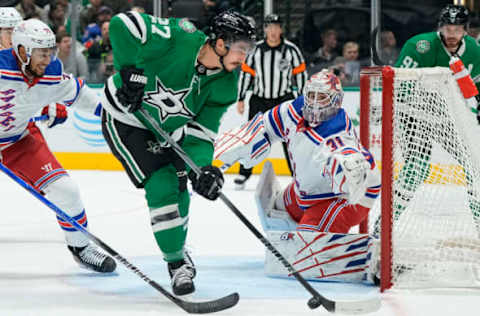 DALLAS, TEXAS – NOVEMBER 20: Igor Shesterkin #31 of the New York Rangers watches as Mason Marchment #27 of the Dallas Stars plays the puck in front of the net during the first period at American Airlines Center on November 20, 2023 in Dallas, Texas. (Photo by Sam Hodde/Getty Images)