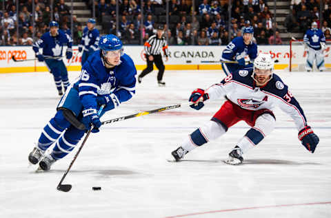 TORONTO, ON – NOVEMBER 19: Mitchell Marner #16 of the Toronto Maple Leafs skates against Boone Jenner #38 of the Columbus Blue Jackets during the second period at the Scotiabank Arena on November 19, 2018 in Toronto, Ontario, Canada. (Photo by Mark Blinch/NHLI via Getty Images)