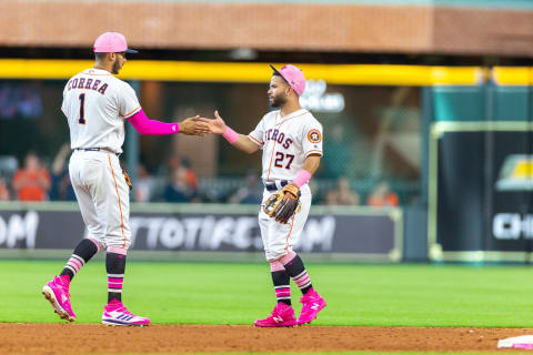 HOUSTON, TX-MAY 13: Houston Astros shortstop Carlos Correa (1) and Houston Astros second baseman Jose Altuve (27) celebrate at the end of an MLB baseball game between the Houston Astros and the Texas Rangers on May 13, 2018, at Minute Maid Park in Houston, Texas. (Photo by Juan DeLeon/Icon Sportswire via Getty Images)