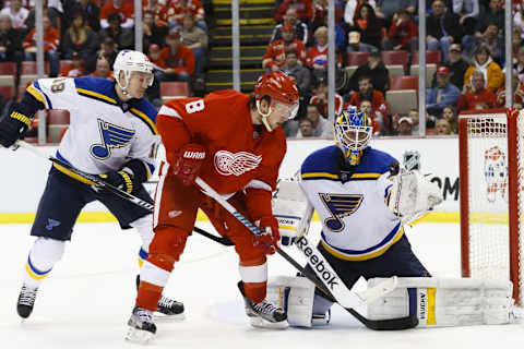 Mar 22, 2015; Detroit, MI, USA; St. Louis Blues goalie Jake Allen (34) makes a save on Detroit Red Wings left wing Justin Abdelkader (8) in the third period at Joe Louis Arena. Detroit won 2-1 in overtime. Mandatory Credit: Rick Osentoski-USA TODAY Sports