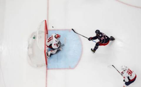 Mar 17, 2022; Columbus, Ohio, USA; Columbus Blue Jackets right wing Oliver Bjorkstrand (28) scores a goal against Washington Capitals goalie Vitek Vanecek (41) during the second period at Nationwide Arena. Mandatory Credit: Russell LaBounty-USA TODAY Sports