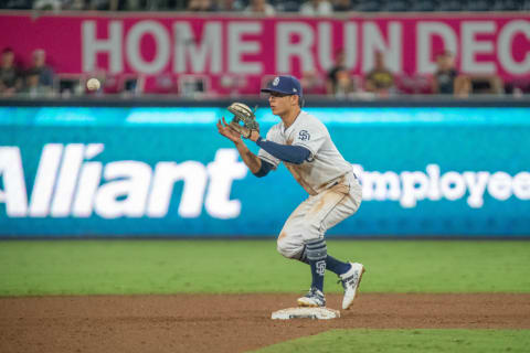 SAN DIEGO, CA – AUGUST 30: San Diego Padres Infielder Luis Urias (9) makes an out at second during a MLB game between the Colorado Rockies and the San Diego Padres on August 30, 2018, at Petco Park in San Diego, CA. (Photo by Justin Fine/Icon Sportswire via Getty Images)