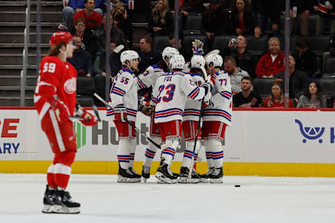 Mar 30, 2022; Detroit, Michigan, USA; New York Rangers left wing Artemi Panarin (10) celebrates with teammates after scoring in the second period against the Detroit Red Wings at Little Caesars Arena. Mandatory Credit: Rick Osentoski-USA TODAY Sports