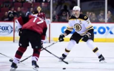 Nov 12, 2016; Glendale, AZ, USA; Boston Bruins defenseman Zdeno Chara (33) defends as Arizona Coyotes right wing Radim Vrbata (17) carries the puck during the first period at Gila River Arena. Mandatory Credit: Matt Kartozian-USA TODAY Sports