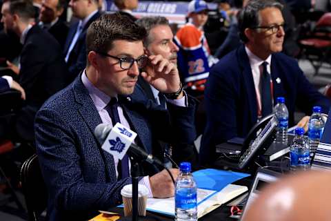 MONTREAL, QUEBEC – JULY 08: General manager Kyle Dubas of the Toronto Maple Leafs looks on from the draft table during Round Two of the 2022 Upper Deck NHL Draft at Bell Centre on July 08, 2022 in Montreal, Quebec, Canada. (Photo by Bruce Bennett/Getty Images)