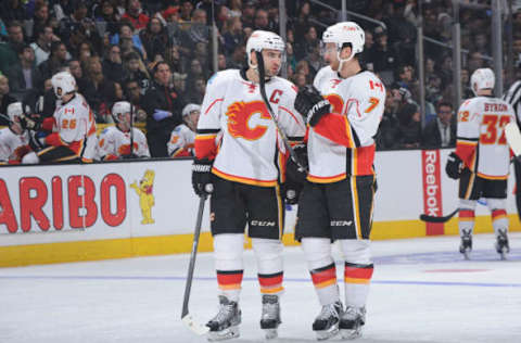 LOS ANGELES, CA – DECEMBER 22: Mark Giordano #5 of the Calgary Flames converses with T.J. Brodie #7 of the Calgary Flames during a game against the Los Angeles Kings at STAPLES Center on December 22, 2014 in Los Angeles, California. (Photo by Juan Ocampo/NHLI via Getty Images)