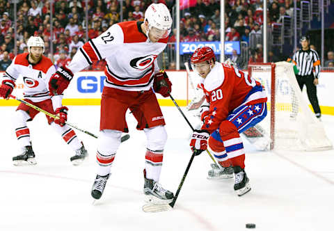 WASHINGTON, DC – DECEMBER 27: Carolina Hurricanes defenseman Brett Pesce (22) works against Washington Capitals center Lars Eller (20) in the second period on December 27, 2018, at the Capital One Arena in Washington, D.C. (Photo by Mark Goldman/Icon Sportswire via Getty Images)