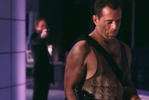 Alan Rickman and Bruce Willis in Die Hard (1988).