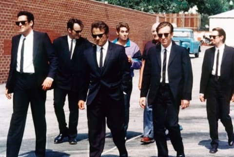 Steve Buscemi, Harvey Keitel, Quentin Tarantino, Michael Madsen, Tim Roth, Chris Penn, Edward Bunker, and Lawrence Tierney in Reservoir Dogs (1992).