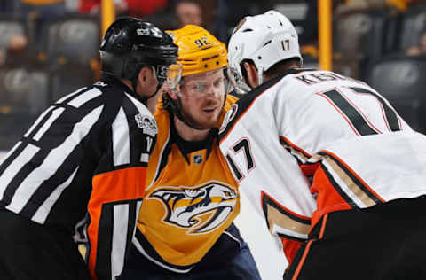 NASHVILLE, TN: Referee Kelly Sutherland skates into a conversation between Ryan Johansen #92 of the Nashville Predators and Ryan Kesler #17 of the Anaheim Ducks before a face-off in Game 4 of the 2017 Western Conference Final on May 18, 2017. (Photo by John Russell/NHLI via Getty Images)