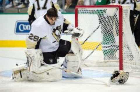 Mar 19, 2015; Dallas, TX, USA; Pittsburgh Penguins goalie Marc-Andre Fleury (29) loses his helmet during the second period against the Dallas Stars at the American Airlines Center. Mandatory Credit: Jerome Miron-USA TODAY Sports