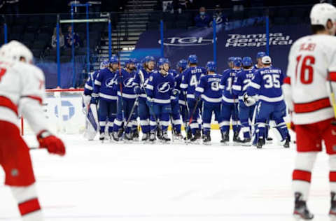 Feb 24, 2021; Tampa, Florida, USA; Tampa Bay Lightning left wing Ross Colton (79) and teammates celebrate as they beat the Carolina Hurricanes during the second period at Amalie Arena. Mandatory Credit: Kim Klement-USA TODAY Sports