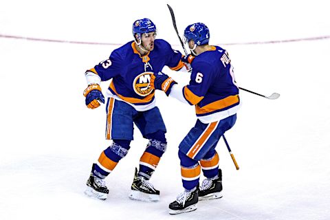 Mathew Barzal #13 and Ryan Pulock #6 of the New York Islanders (Photo by Elsa/Getty Images)