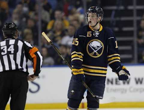 Feb 21, 2016; Buffalo, NY, USA; Buffalo Sabres center Jack Eichel (15) complains to referee Brad Meier (34) after getting a cross checking penalty during the second period against the Pittsburgh Penguins at First Niagara Center. Mandatory Credit: Kevin Hoffman-USA TODAY Sports