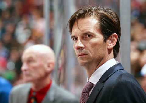 VANCOUVER, BC – OCTOBER 11: Head coach Dallas Eakins of the Edmonton Oilers looks on from the bench during their NHL game against the Vancouver Canucks at Rogers Arena October 11, 2014 in Vancouver, British Columbia, Canada. Vancouver won 5-4 in a shootout. (Photo by Jeff Vinnick/NHLI via Getty Images)