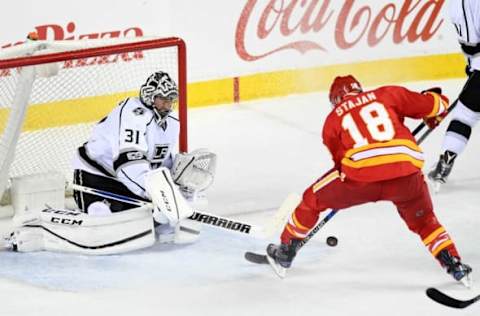 Mar 19, 2017; Calgary, Alberta, CAN; Calgary Flames center Matt Stajan (18) on a break away against Los Angeles Kings goalie Ben Bishop (31) during the third period at Scotiabank Saddledome. The Flames won 5-2. Mandatory Credit: Candice Ward-USA TODAY Sports