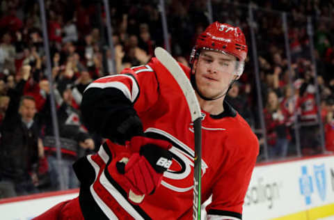 RALEIGH, NC – DECEMBER 05: Andrei Svechnikov #37 of the Carolina Hurricanes scores a shootout goal and celebrates during an NHL game against the San Jose Sharks on December 5, 2019 at PNC Arena in Raleigh, North Carolina. (Photo by Gregg Forwerck/NHLI via Getty Images)