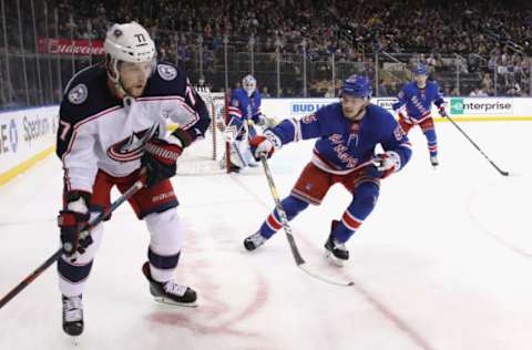 NEW YORK, NEW YORK – APRIL 05: Ryan Lindgren #55 of the New York Rangers defends against Josh Anderson #77 of the Columbus Blue Jackets during the first period at Madison Square Garden on April 05, 2019 in New York City. (Photo by Bruce Bennett/Getty Images)