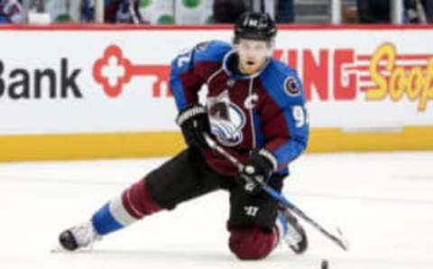 Dec 22, 2016; Denver, CO, USA; Colorado Avalanche left wing Gabriel Landeskog (92) controls the puck in the second period against the Toronto Maple Leafs at the Pepsi Center. Mandatory Credit: Isaiah J. Downing-USA TODAY Sports