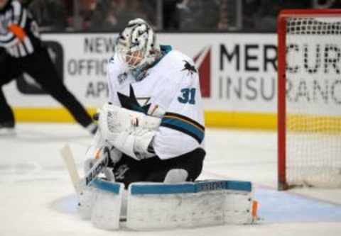 February 2, 2016; Anaheim, CA, USA; San Jose Sharks goalie Martin Jones (31) blocks a shot against Anaheim Ducks during the second period at Honda Center. Mandatory Credit: Gary A. Vasquez-USA TODAY Sports