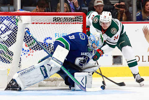 VANCOUVER, BC – DECEMBER 4: Anders Nilsson #31 of the Vancouver Canucks makes a save off the shot of Joel Eriksson Ek #14 of the Minnesota Wild during their NHL game at Rogers Arena December 4, 2018 in Vancouver, British Columbia, Canada. The Wild won 3-2. (Photo by Jeff Vinnick/NHLI via Getty Images)