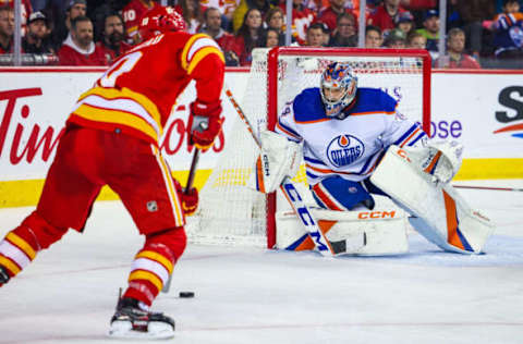 Dec 27, 2022; Calgary, Alberta, CAN; Edmonton Oilers goaltender Stuart Skinner (74) guards his net against the Calgary Flames during the second period at Scotiabank Saddledome. Mandatory Credit: Sergei Belski-USA TODAY Sports