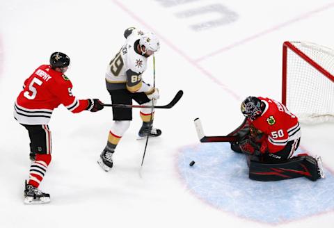 Alex Tuch #89 of the Vegas Golden Knights is stopped by Corey Crawford #50 of the Chicago Blackhawks during the second period in Game Three of the Western Conference First Round. (Photo by Jeff Vinnick/Getty Images)