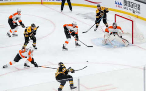 Jan 23, 2021; Boston, Massachusetts, USA; Boston Bruins left wing Brad Marchand (63) scores a goal during the third period against the Philadelphia Flyers at TD Garden. Mandatory Credit: Paul Rutherford-USA TODAY Sports