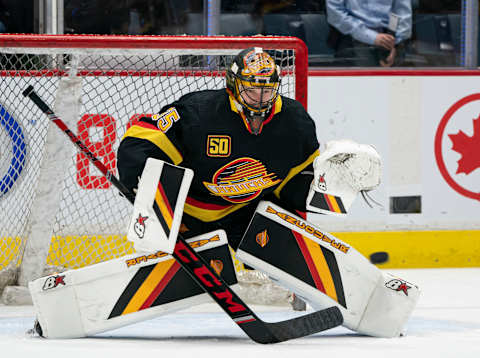 VANCOUVER, BC – NOVEMBER 16: Thatcher Demko #35 of the Vancouver Canucks makes a save during the pre game warm up prior to NHL action against the Colorado Avalanche at Rogers Arena on November 16, 2019 in Vancouver, Canada. (Photo by Rich Lam/Getty Images)