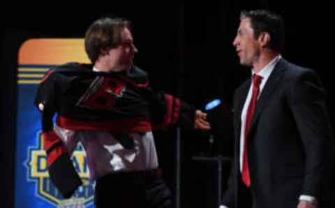 Jun 28, 2023; Nashville, Tennessee, USA; Carolina Hurricanes draft pick Bradly Nadeau talks with head coach Rod BrindAmour after being selected with the thirtieth pick in round one of the 2023 NHL Draft at Bridgestone Arena. Mandatory Credit: Christopher Hanewinckel-USA TODAY Sports