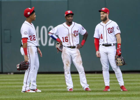 WASHINGTON, DC – SEPTEMBER 26: Washington Nationals outfielder Juan Soto (22), Victor Robles (16) and Bryce Harper (34) talks during a pitching change against the Miami Marlins at Nationals Park. (Photo by Jonathan Newton / The Washington Post via Getty Images)