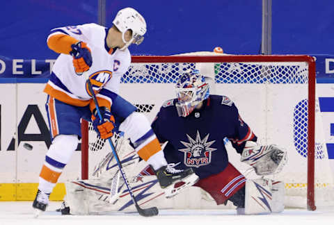 Anders Lee #27 of the New York Islanders attempts to deflect a second period shot but he is stopped by Igor Shesterkin #31 of the New York Rangers Mandatory Credit: Bruce Bennett/Pool Photo-USA TODAY Sports