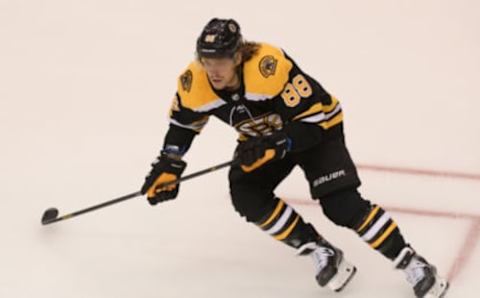 Aug 12, 2020; Toronto, Ontario, CAN; Boston Bruins right wing David Pastrnak (88) chases the puck against the Carolina Hurricanes in the first period in game one of the first round of the 2020 Stanley Cup Playoffs at Scotiabank Arena. Mandatory Credit: Dan Hamilton-USA TODAY Sports