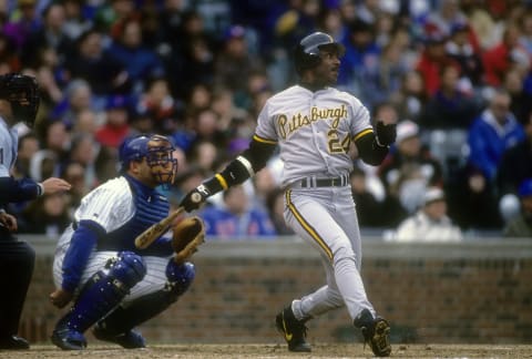 CHICAGO, IL – CIRCA 1992: Barry Bonds #24 of the Pittsburgh Pirates swings and watches the flight of his ball against the Chicago Cubs during a Major League Baseball game circa 1992 at Wrigley Field in Chicago, Illinois. Bonds played for the Pirates from 1986-92. (Photo by Focus on Sport/Getty Images)