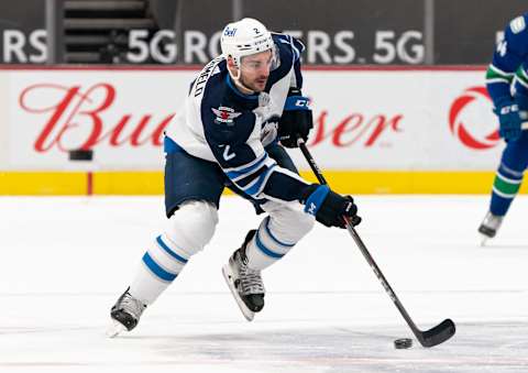 Winnipeg Jets, Dylan DeMelo #2. (Photo by Rich Lam/Getty Images)