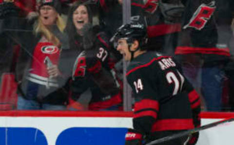 Jan 29, 2023; Raleigh, North Carolina, USA; Carolina Hurricanes center Seth Jarvis (24) celebrates his goal against the Boston Bruins during the third period at PNC Arena. Mandatory Credit: James Guillory-USA TODAY Sports