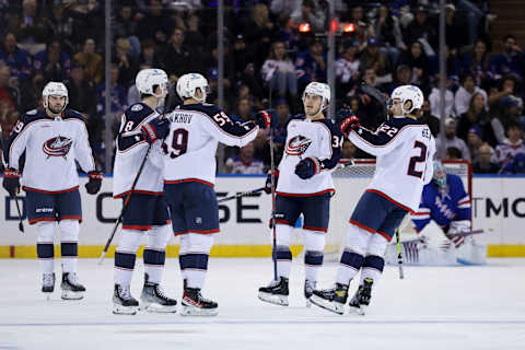 Oct 23, 2022; New York, New York, USA; Columbus Blue Jackets right wing Yegor Chinakhov (59) celebrates with Columbus Blue Jackets center Cole Sillinger (34), Columbus Blue Jackets defenseman Jake Bean (22), and additional teammates after scoring a goal against New York Rangers goaltender Jaroslav Halak (41) during the second period at Madison Square Garden. Mandatory Credit: Jessica Alcheh-USA TODAY Sports