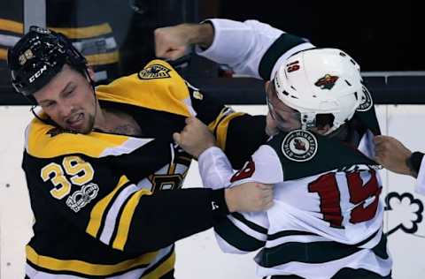 BOSTON – NOVEMBER 6: Boston Bruins’ Matt Beleskey (39) and Minnesota’s Luke Kunin (19) fight during the first period. The Boston Bruins host the Minnesota Wild in a regular season NHL hockey game at TD Garden in Boston on Nov. 6, 2017. (Photo by Jim Davis/The Boston Globe via Getty Images)