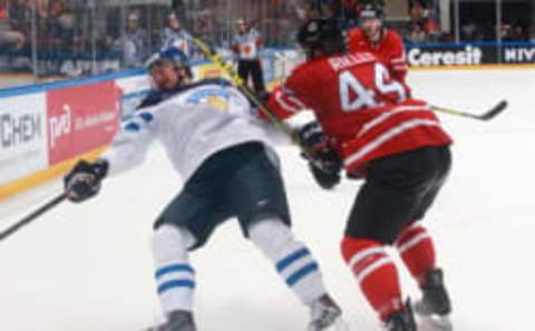 Finland’s Jussi Jokinen (L) and Canada’s Morgan Rielly fight for the puck in their 2016 IIHF World Championship final ice hockey match at VTB Ice Palace in Moscow, Russia, May 22, 2016. Sergei Fadeichev/TASS (Photo by Sergei Fadeichev\TASS via Getty Images)