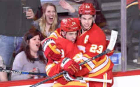 Feb 27, 2016; Calgary, Alberta, CAN; Calgary Flames left wing Johnny Gaudreau (13) celebrates his second period goal with center Sean Monahan (23) against the Ottawa Senators at Scotiabank Saddledome. Mandatory Credit: Candice Ward-USA TODAY Sports