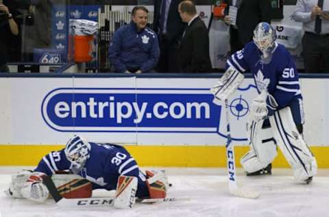 TORONTO, ON – JANUARY 12: Toronto Maple Leafs Goalie Michael Hutchinson (30) and teammate Goalie Kasimir Kaskisuo (50) warmup in front of the Leafs bench before the regular season NHL game between the Boston Bruins and Toronto Maple Leafs on January 12, 2019 at Scotiabank Arena in Toronto, ON. (Photo by Jeff Chevrier/Icon Sportswire via Getty Images)