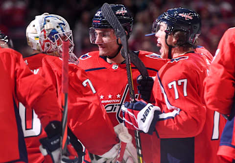 WASHINGTON, DC – JANUARY 05: Washington Capitals goaltender Braden Holtby (70) celebrates with right wing Garnet Hathaway (21) and right wing T.J. Oshie (77) against the San Jose Sharks on January 5, 2020 at the Capital One Arena in Washington, D.C. (Photo by Mark Goldman/Icon Sportswire via Getty Images)