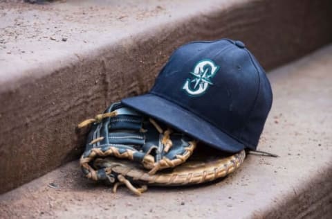 Aug 18, 2015; Arlington, TX, USA; A view of a Seattle Mariners ball cap and glove during the game between the Texas Rangers and the Seattle Mariners at Globe Life Park in Arlington. The Mariners defeat the Rangers 3-2. Mandatory Credit: Jerome Miron-USA TODAY Sports