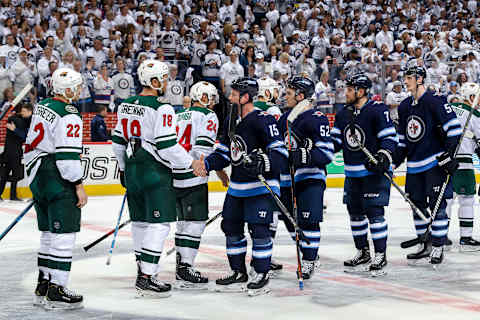 WINNIPEG, MB – APRIL 20: Matt Hendricks #15 of the Winnipeg Jets shakes hands with Jordan Greenway #18 of the Minnesota Wild in the tradtional handshake line following a 5-0 Jets victory in Game Five of the Western Conference First Round during the 2018 NHL Stanley Cup Playoffs at the Bell MTS Place on April 20, 2018 in Winnipeg, Manitoba, Canada. The Jets won the series 4-1. (Photo by Jonathan Kozub/NHLI via Getty Images)