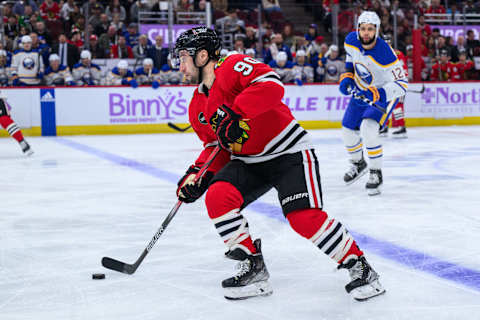 Nov 19, 2023; Chicago, Illinois, USA; Chicago Blackhawks center Tyler Johnson (90) skates with the puck against the Buffalo Sabres during the first period at the United Center. Mandatory Credit: Daniel Bartel-USA TODAY Sports