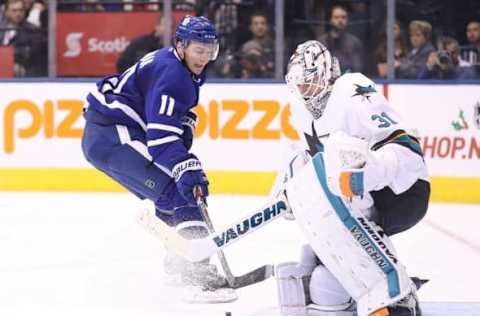 Dec 13, 2016; Toronto, Ontario, CAN; Toronto Maple Leafs center Zach Hyman (11) is stopped on a breakaway by San Jose Sharks goalie Martin Jones (31) at Air Canada Centre. The Sharks beat the Maple Leafs 3-2 in the shootout. Mandatory Credit: Tom Szczerbowski-USA TODAY Sports