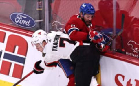 Apr 3, 2021; Montreal, Quebec, CAN; Montreal Canadiens defenseman Shea Weber (6) is checked into the boards by Ottawa Senators left wing Brady Tkachuk (7) during the first period at Bell Centre. Mandatory Credit: Jean-Yves Ahern-USA TODAY Sports