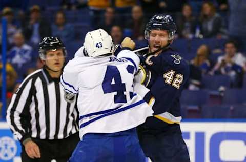 Dec 5, 2015; St. Louis, MO, USA; St. Louis Blues center David Backes (42) and Toronto Maple Leafs center Nazem Kadri (43) fight during the second period at Scottrade Center. Mandatory Credit: Billy Hurst-USA TODAY Sports