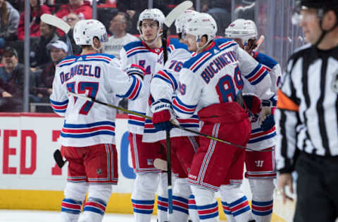 DETROIT, MI – MARCH 07: Pavel Buchnevich #89 of the New York Rangers celebrates his third period goal with teammates Tony DeAngelo #77 and Brady Skjei #76 during an NHL game against the Detroit Red Wings at Little Caesars Arena on March 7, 2019 in Detroit, Michigan. (Photo by Dave Reginek/NHLI via Getty Images)