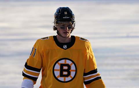 Feb 21, 2021; Stateline, Nevada, USA; Boston Bruins center Trent Frederic (11) against the Philadelphia Flyers during the first period in a NHL Outdoors hockey game at Lake Tahoe. Mandatory Credit: Kirby Lee-USA TODAY Sports